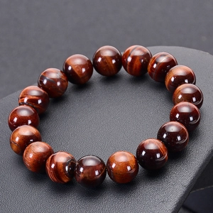 Natural red tiger eye beaded bracelet featuring polished 12mm gemstones with cat eye effect
