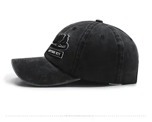 Close-up of side view of washed denim baseball cap with New York City embroidery