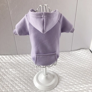 Detail of purple pet hoodie featuring soft fleece fabric and functional back pocket design
