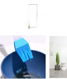 Detail display of silicone basting brush with blue bristles and transparent handle