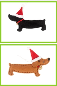 Detail of dachshund felt ornaments with Christmas hats and golden bells for tree decoration