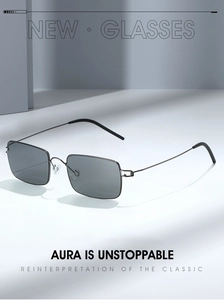 Detail of ultra-light screwless rectangle sunglasses with thin metal frames and dark lenses