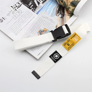 White nylon canvas belt with black plastic buckle and decorative industrial patches