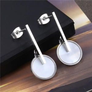 Silver stainless steel drop earrings with circular shell pendants in minimalist style