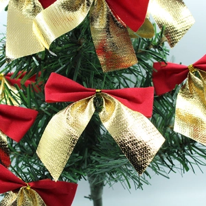 8cm red and gold Christmas tree bow ornaments hanging on green pine tree branches