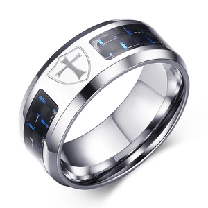 Detail of 8mm stainless steel ring with blue carbon fiber inlay and cross shield relief