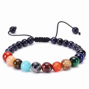 Close-up of solar system bracelet showing natural stone beads and adjustable cord