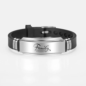 Detail of black silicone bracelet with polished metal plate engraved with Family message