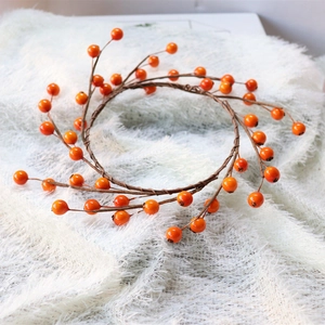 Halloween orange berry wreath with glossy berries and brown vine for table decor