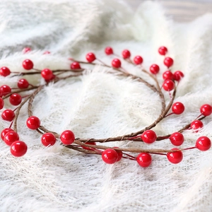 Artificial red berry wreath with vibrant glossy berries for festive home Christmas decor