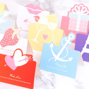 3D hollow-out colorful greeting cards with assorted designs on marble surface