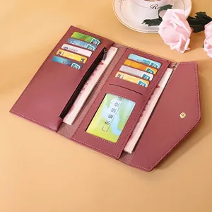 Elegant mauve long tri-fold wallet with multiple card slots and gold metal clasp
