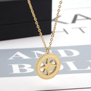 Gold-plated compass pendant necklace with celestial star detail and nautical coin charm