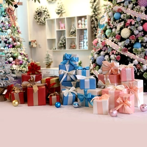 Colorful Christmas gift boxes set with silk ribbons for holiday window display and mall decor