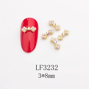 Détail bijou d'ongle nœud en alliage 3x8mm avec perles et cristaux scintillants