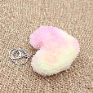 Pink and yellow gradient heart plush keychain with metal ring on linen background
