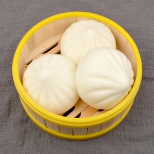 Realistic 7cm steamed bun food models in a bamboo steamer for educational toy display