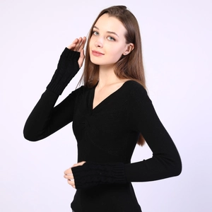 Detail of black cable knit fingerless gloves with thumb hole for winter warmth