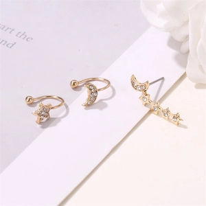 Detail shot of the rhinestone-encrusted star and moon earring 3-piece set