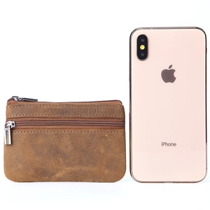 Brown vintage crazy horse leather coin purse with double zippers shown next to a smartphone