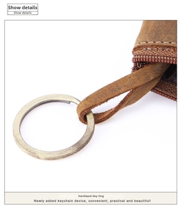 Close-up of vintage brown crazy horse leather coin purse with bronze hardware key ring