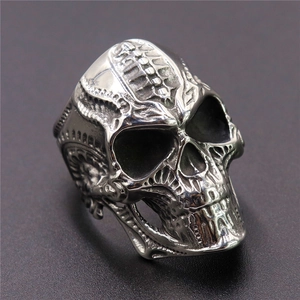 Unisex silver stainless steel skull ring with punk gothic carved details in center view