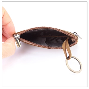 Detail showing the inner lining and storage capacity of a vintage crazy horse leather pouch
