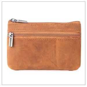 Close-up of vintage brown crazy horse leather coin purse with double zipper design