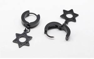 Detail of black stainless steel hoop earrings with hollow hexagram star pendants