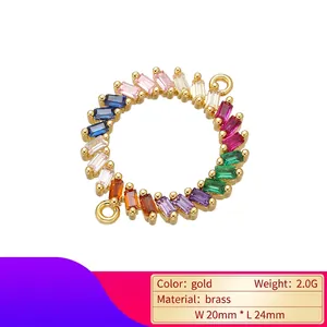 Macro shot of 24mm gold brass pendant with multi-color cubic zirconia rainbow stones