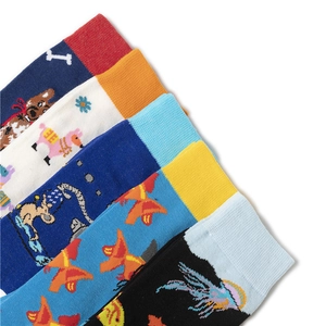 Detailed view of colorful mid-calf socks with various animal and cartoon patterns