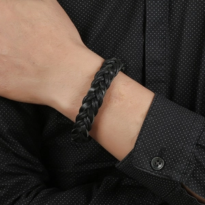 Men's minimalist black woven leather bracelet with magnetic stainless steel clasp on wrist