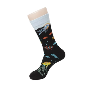 Detail of mid-calf socks with jellyfish and tropical fish patterns on combed cotton