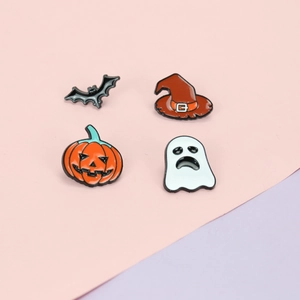 Detail of Halloween enamel pins set featuring a bat, witch hat, pumpkin, and ghost icons