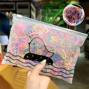 Bulk colorful disposable hair elastics in a matte frosted zipper bag with bird pattern