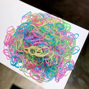 Detailed view of colorful macaron-toned elastic hair bands made of durable high-stretch rubber