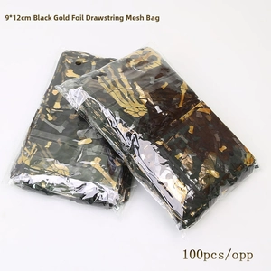Detail of black and gold foil organza bags with skeleton hand prints for Halloween