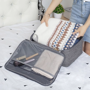 Sac de voyage gris grande capacité avec compartiments en filet pour courts séjours