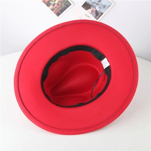 Interior view of red wide brim wool felt fedora showing inner black band and size label