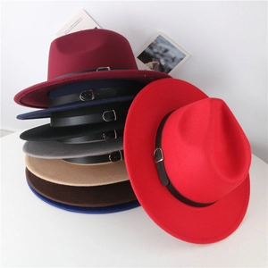 Detail of wool fedora hats in multiple colors featuring leather belts with metal buckles