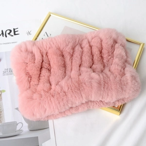 Pink knitted rex rabbit fur neck warmer with thick soft texture on white background
