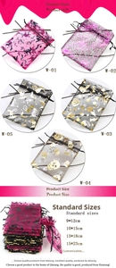 Close-up of Halloween organza drawstring gift bags with gold foil bats and pumpkin patterns