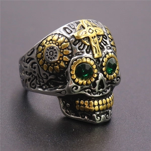 Vintage stainless steel skull ring with gold cross accents and green gemstones