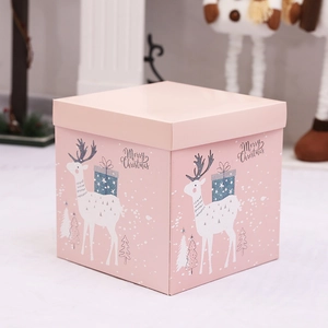 Pink Christmas gift box with reindeer and Merry Christmas print for festive decoration