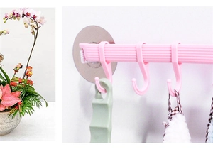 Detail view of pink wall-mounted rack with sliding hooks and strong adhesive mounting
