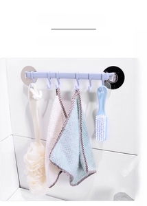 Wall-mounted bathroom rack with 6 hooks holding a loofah and towels on white tiles