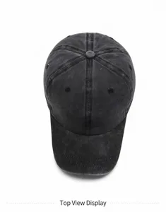 Top down view of a black washed cotton distressed baseball cap with vintage texture