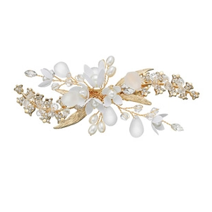 Macro detail of bridal hair clip with silver alloy flowers, pearls and crystal beads