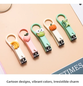 Close-up of portable stainless steel nail clippers with 3D cartoon fruit and animal icons