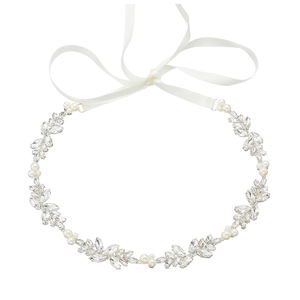 Elegant bridal hair accessory with white pearls, rhinestones, and silk ribbon on white background